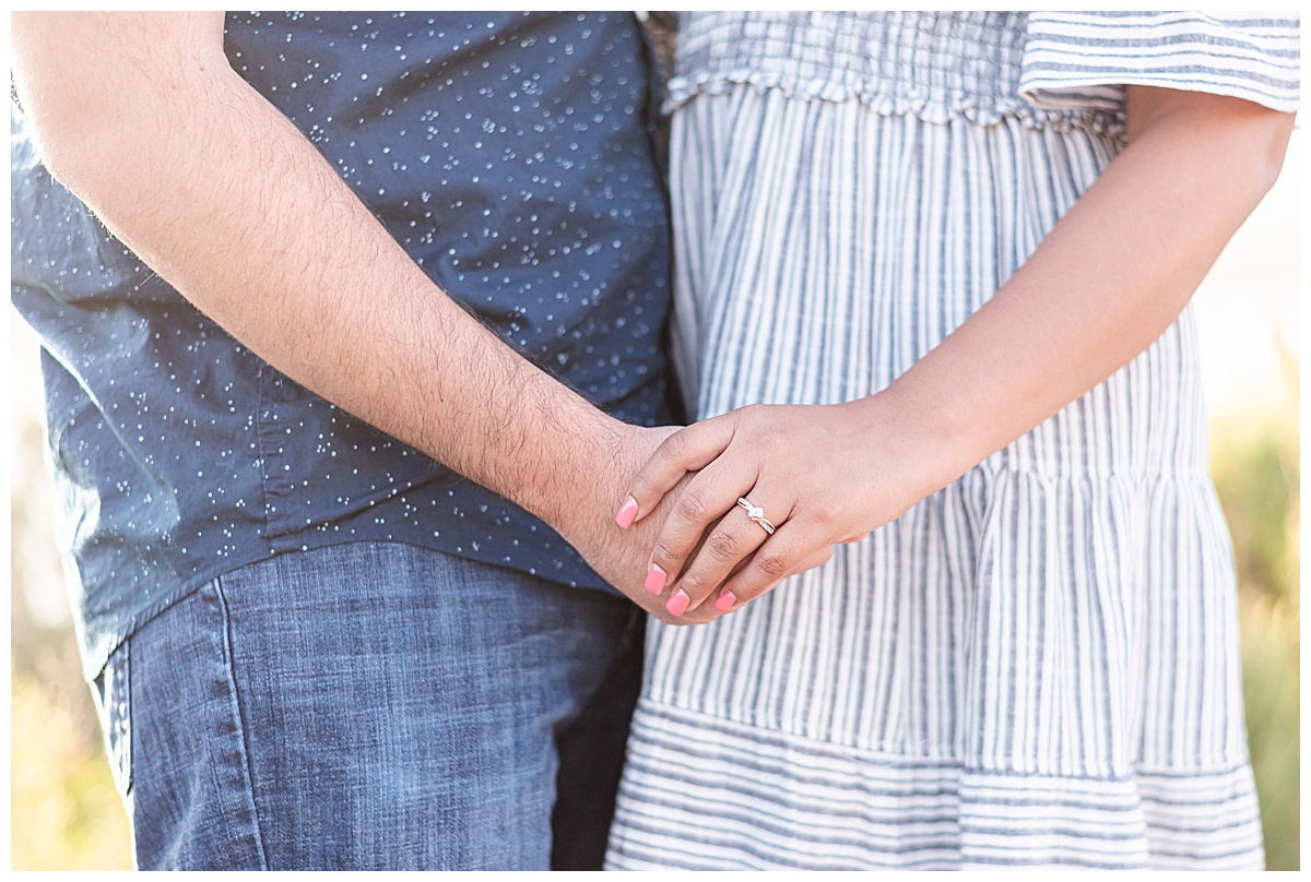 photo of boy and girl holding ring with engagement ring