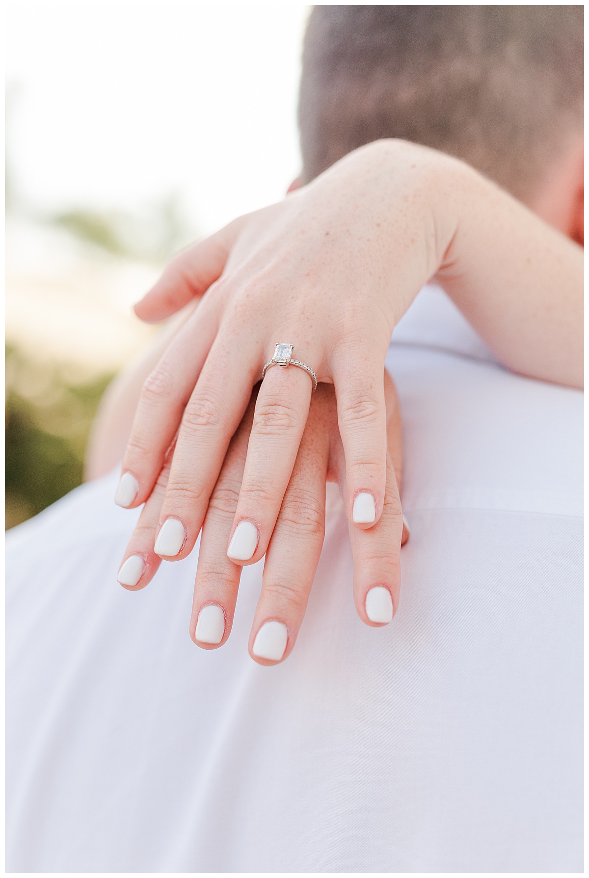 photo of engagement ring on girls finger